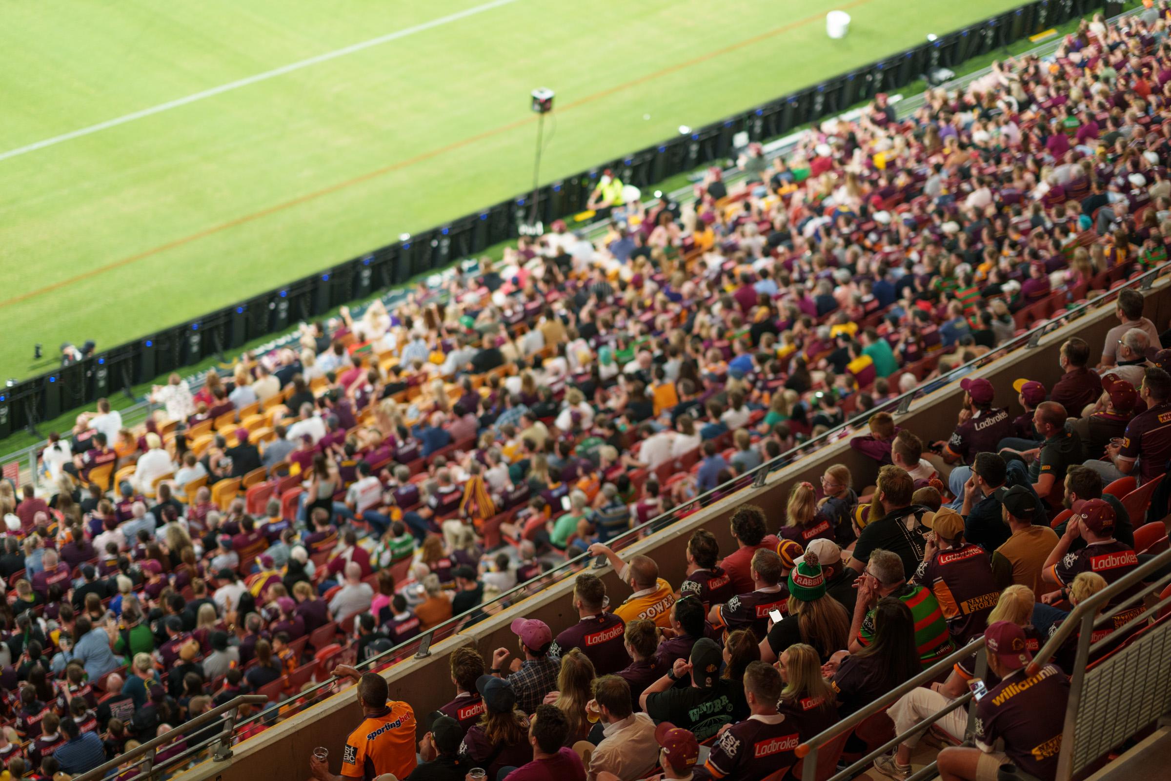 Aerial view of a crowd watching a sports field